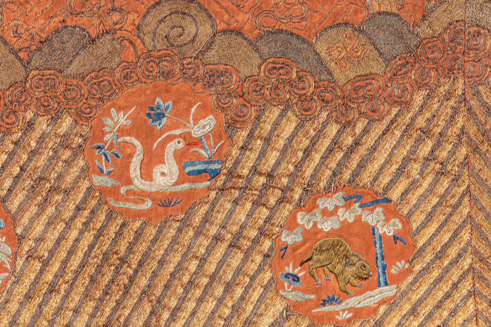 An Apricot Ground Embroidered Silk Lady’s Informal Robe