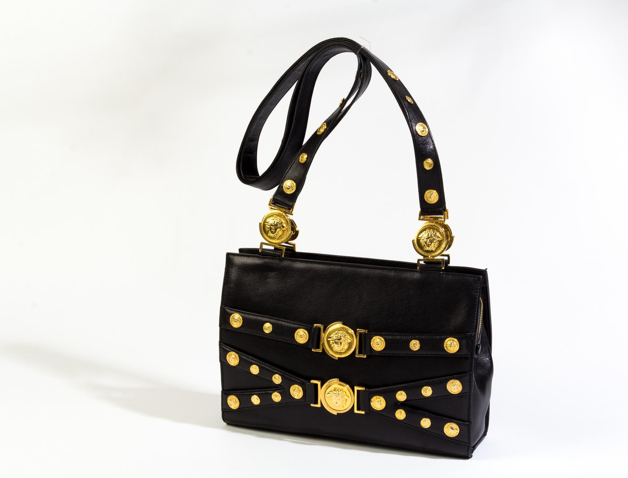 A Gianni Versace Black Leather Medusa Shoulder Bag, 11.75" x 8.5" x 3.5"; Strap drop: 19.5".