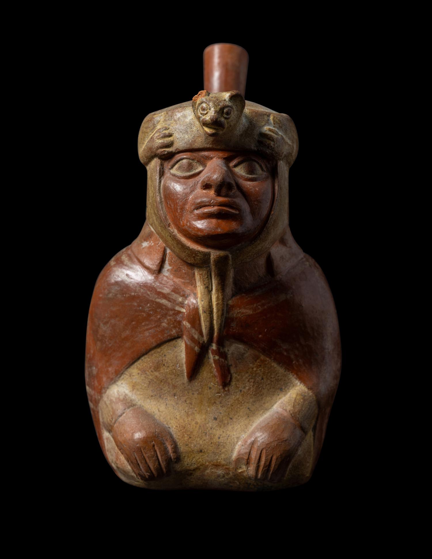 A Moche Stirrup Vessel in the Form of a Shaman with Feline Headdress