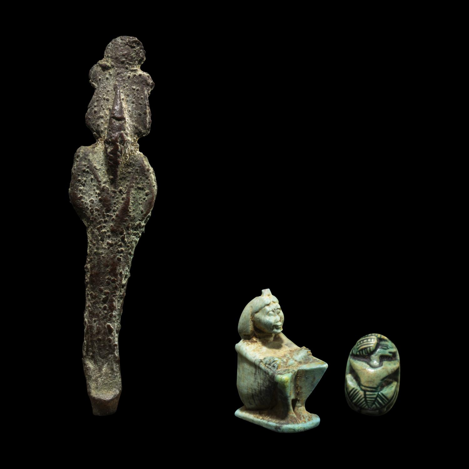 An Egyptian Bronze Osiris, an Egyptian Faience Shu, and an Egyptian Faience Scarab