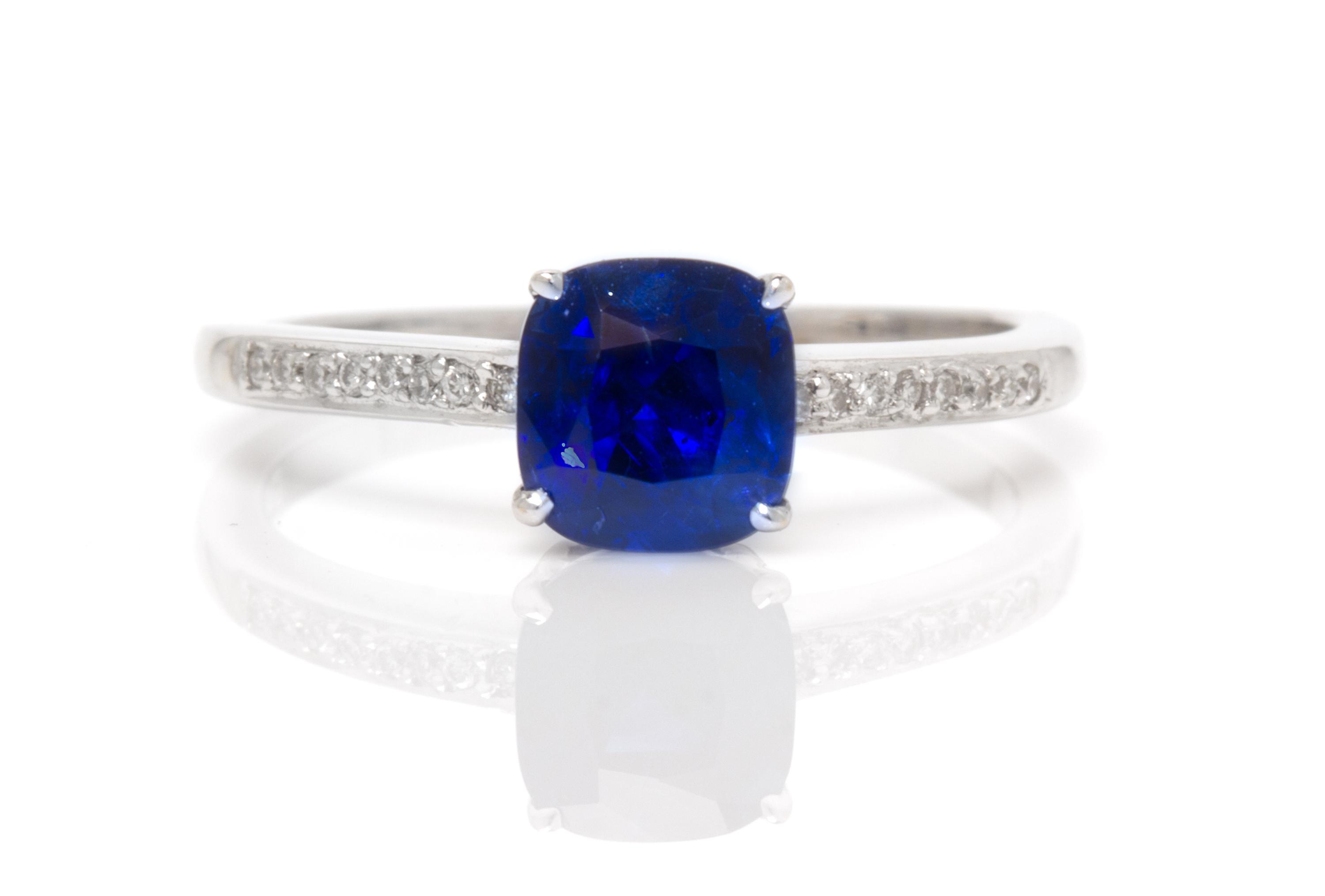 An 18 Karat White Gold, Sapphire and Diamond Ring, 1.80 dwts.