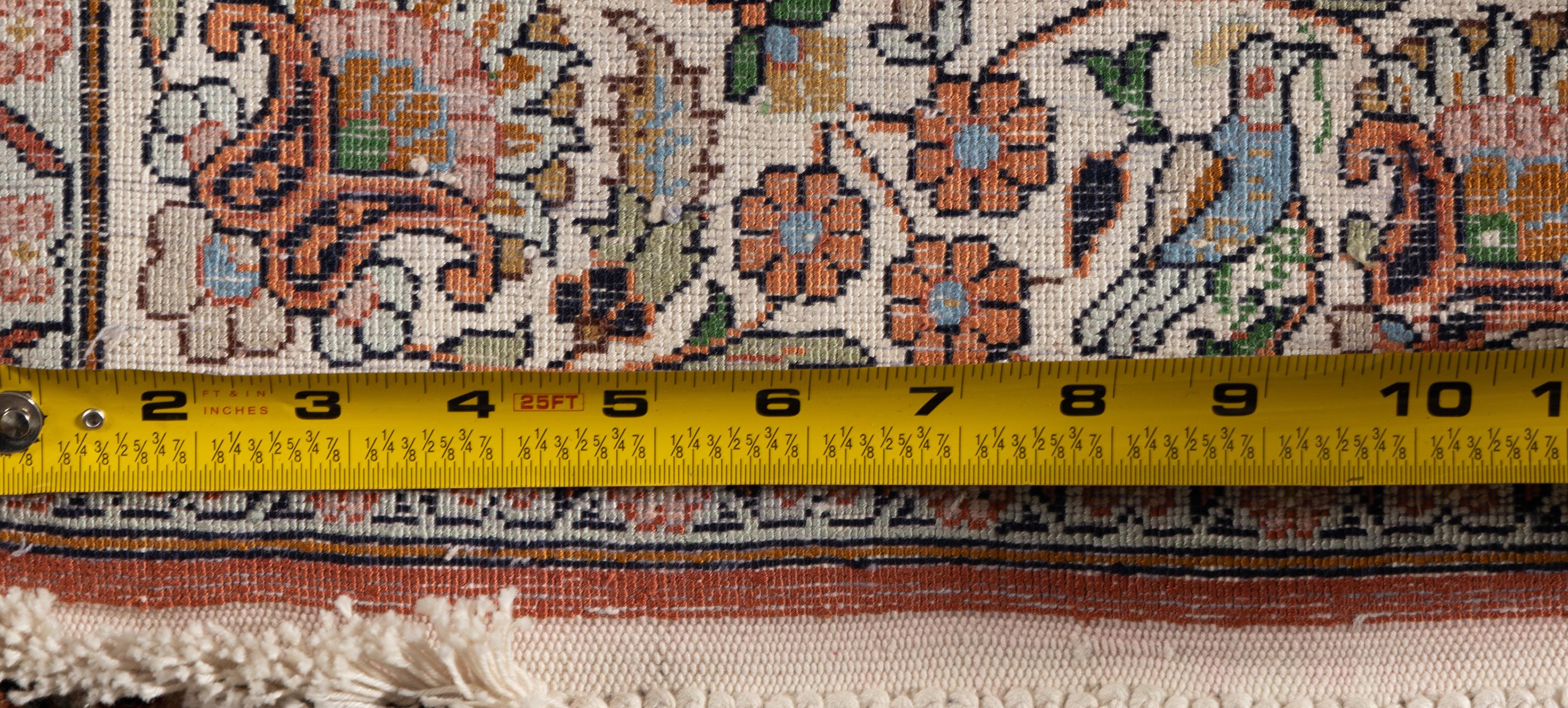An Indo-Qom Silk Rug