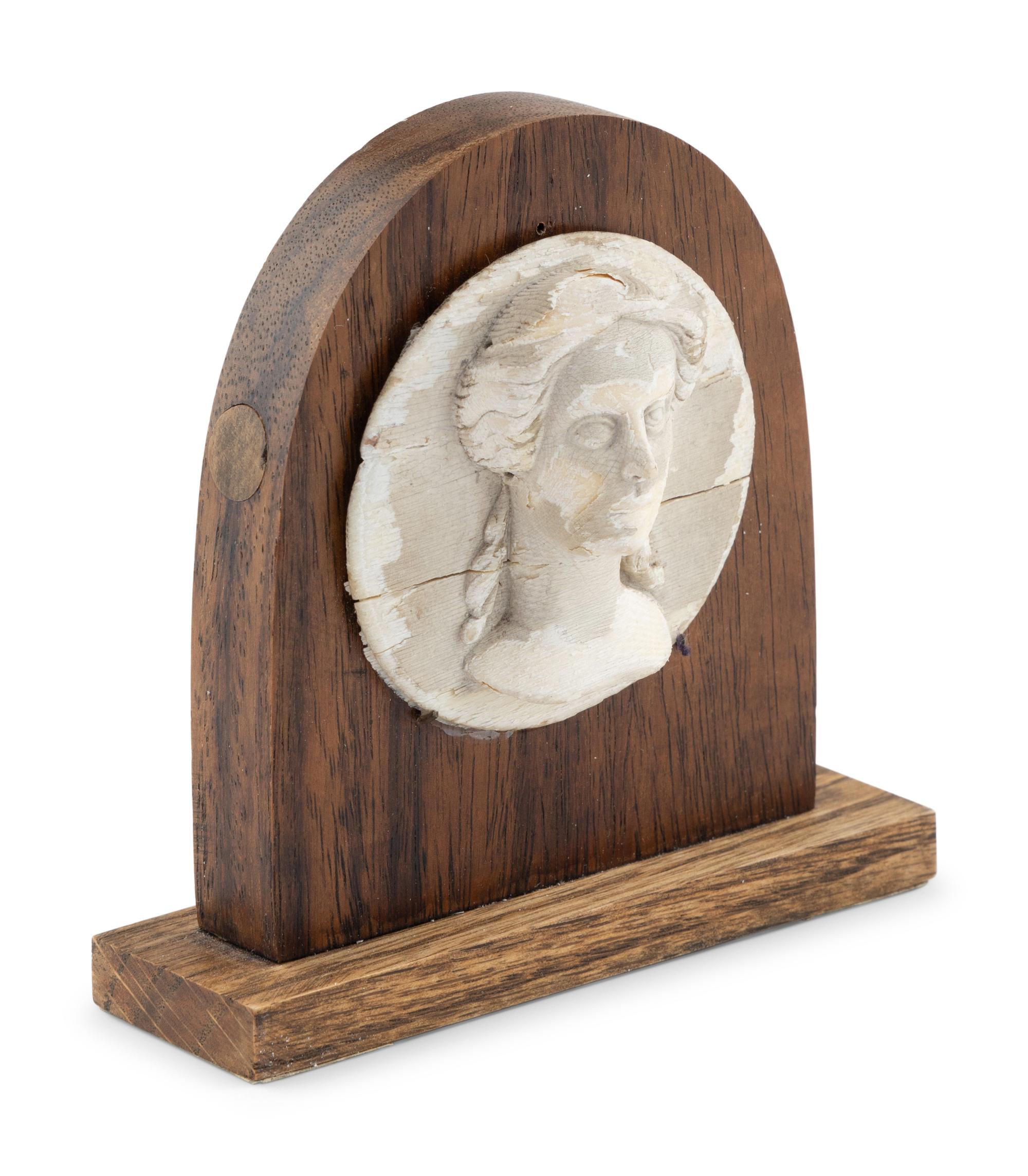 A White Painted Carved Wooden Portrait Relief of a Classical Female