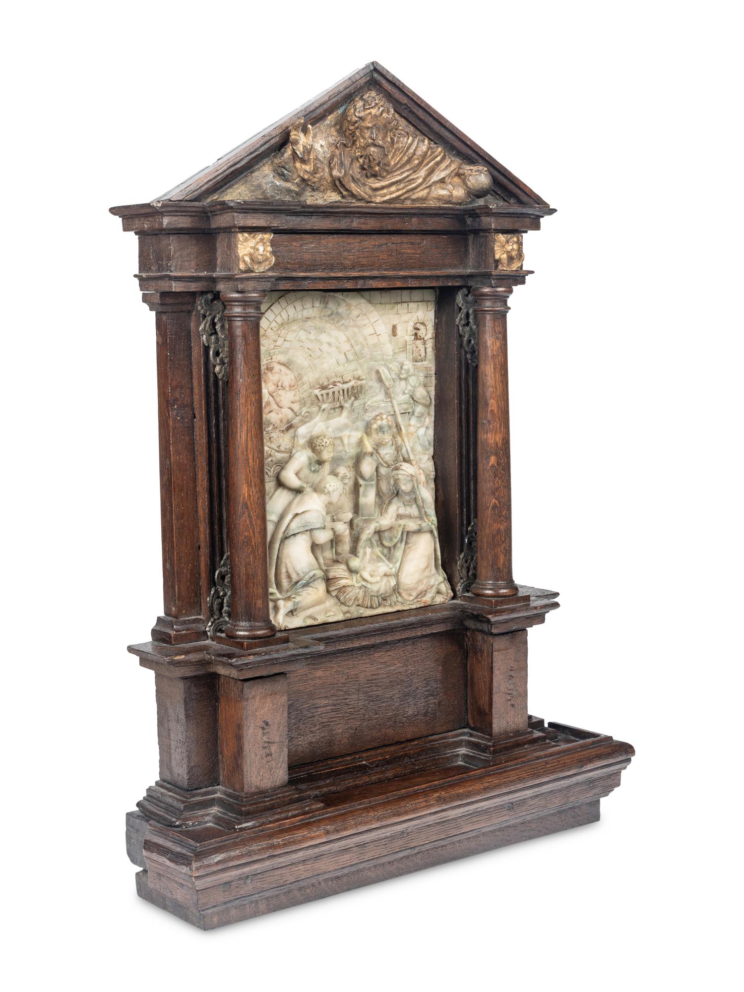 A Carved Stone Relief Panel Set in a Carved Oak and Parcel Gilt Frame