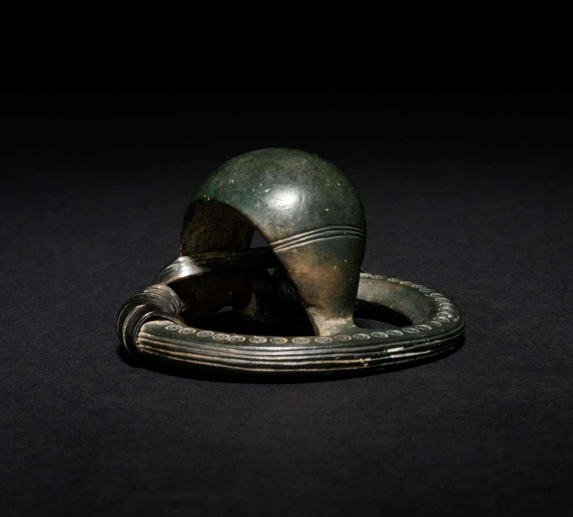 A Celtiberian Bronze Penannular Cupola Fibula
