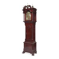 A Colonial Revival Carved Oak Tall Case Clock