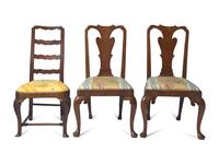 A Group of Three George II Carved and Veneered Walnut and Elm Side Chairs