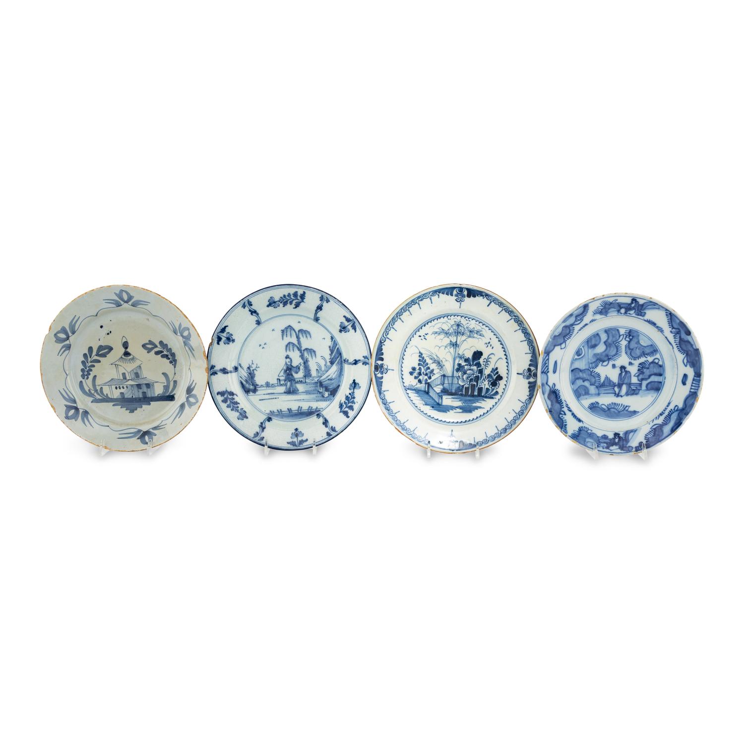 A Collection of Four Delft Blue and White Plates