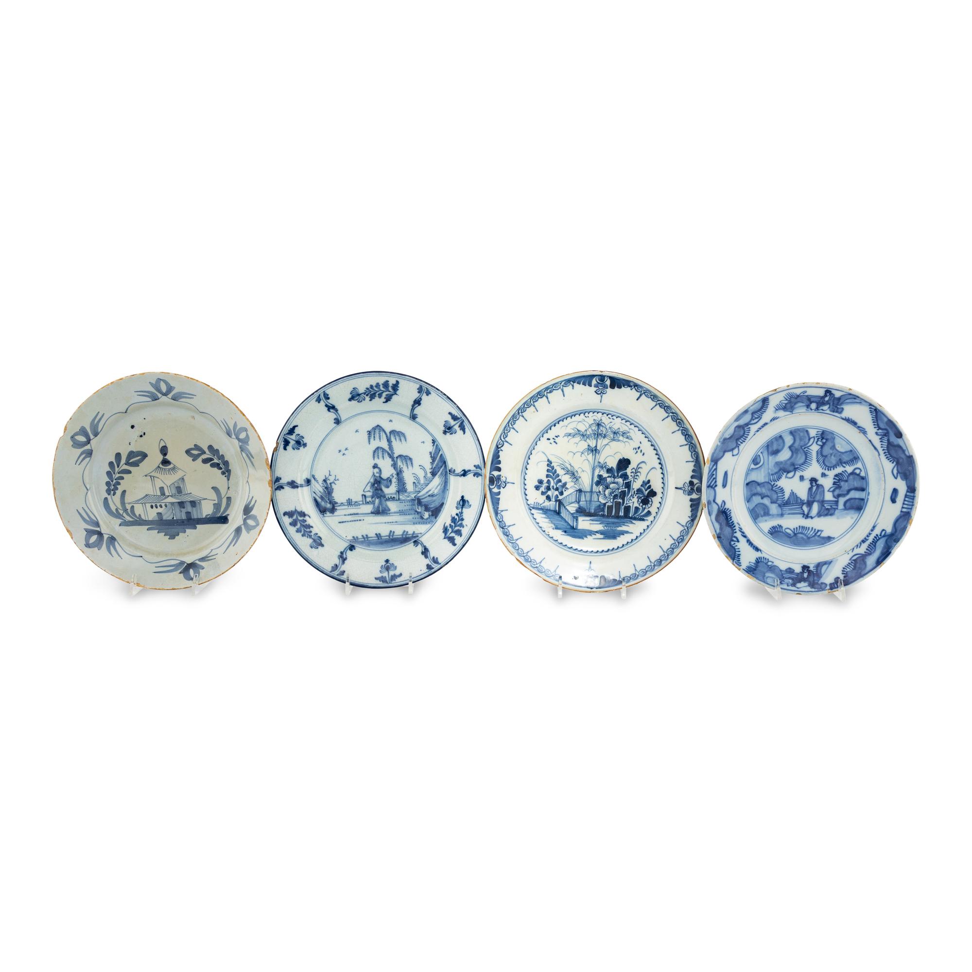 A Collection of Four Delft Blue and White Plates