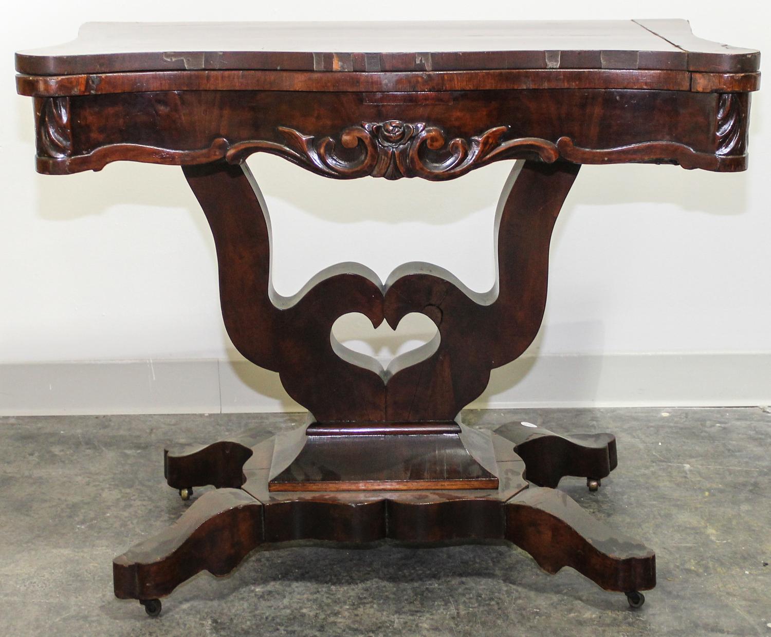 An American Empire Mahogany Game Table Height 29 x width 35 1/4 x depth 18 1/2 inches (closed). — 19TH CENTURY