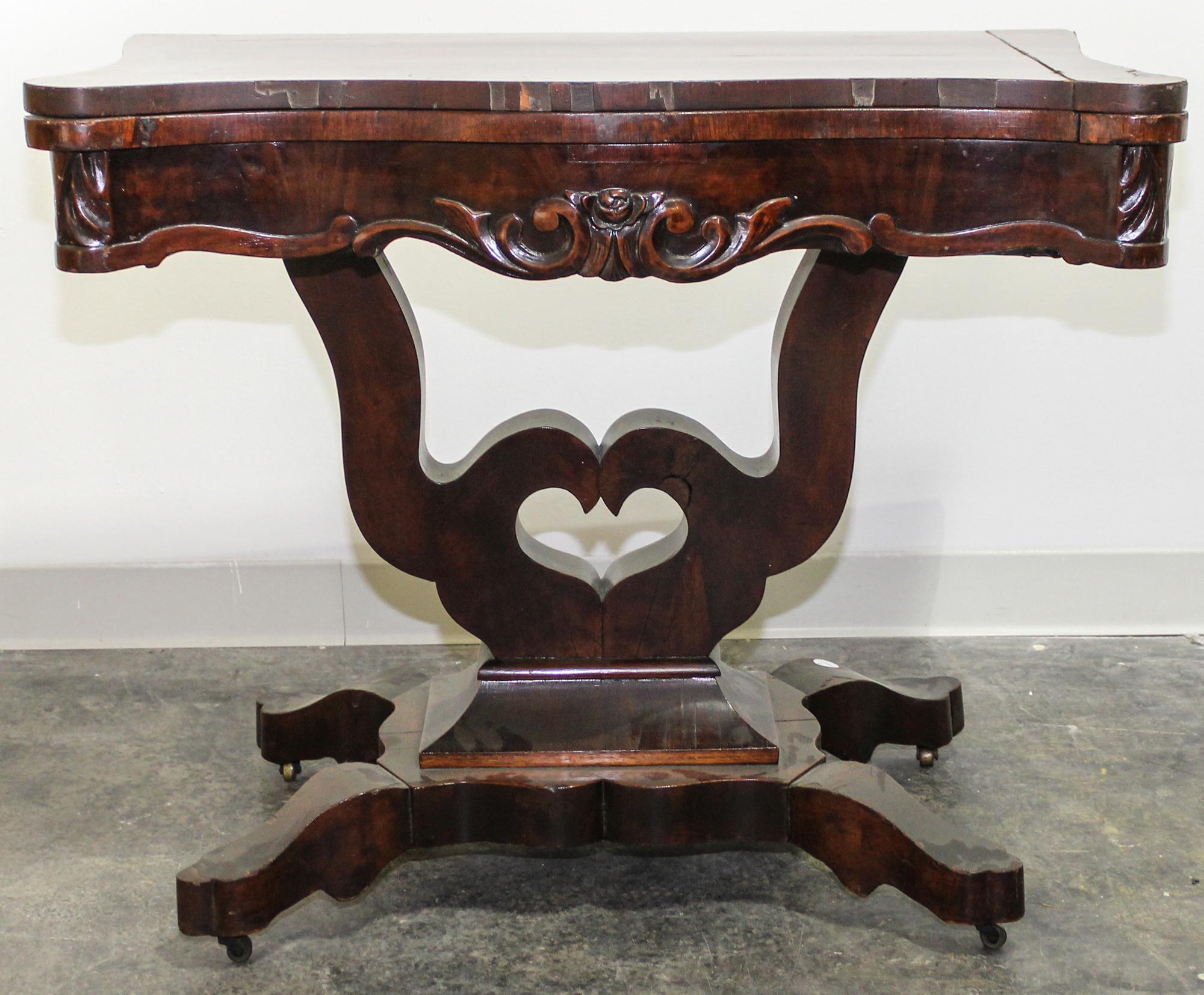 An American Empire Mahogany Game Table Height 29 x width 35 1/4 x depth 18 1/2 inches (closed). — 19TH CENTURY