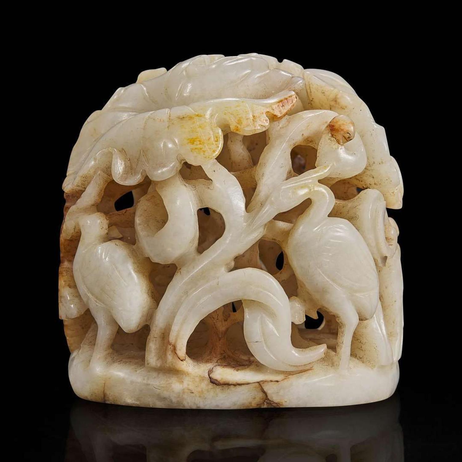 A Chinese reticulated white and russet jade finial 透雕玉炉端