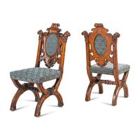 A Set of Six French Carved Oak Dining Chairs