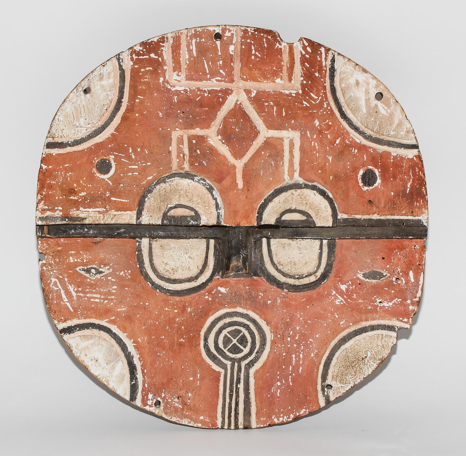 A Bateke Polychromed Wood Mask. Diameter 15 1/2 inches.