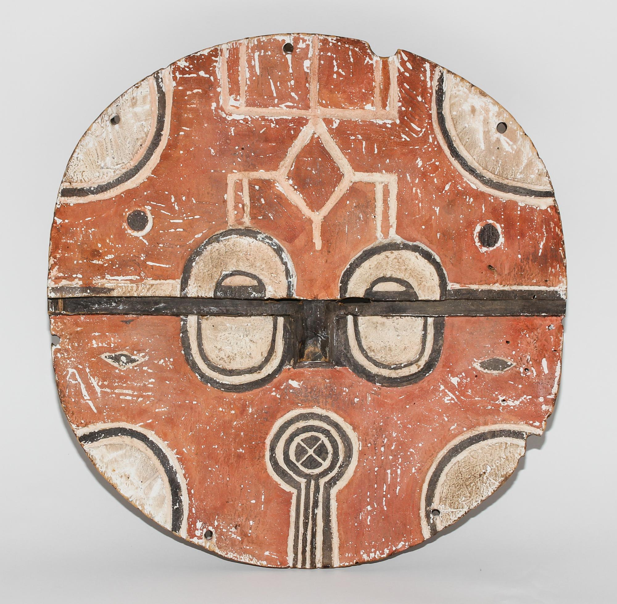A Bateke Polychromed Wood Mask. Diameter 15 1/2 inches.