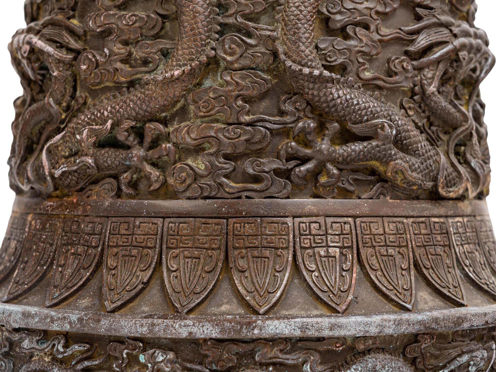 A Pair of Chinese Bronze Candle Holders