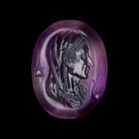 A Roman Amethyst Intaglio with a Portrait Head of a Veiled Man