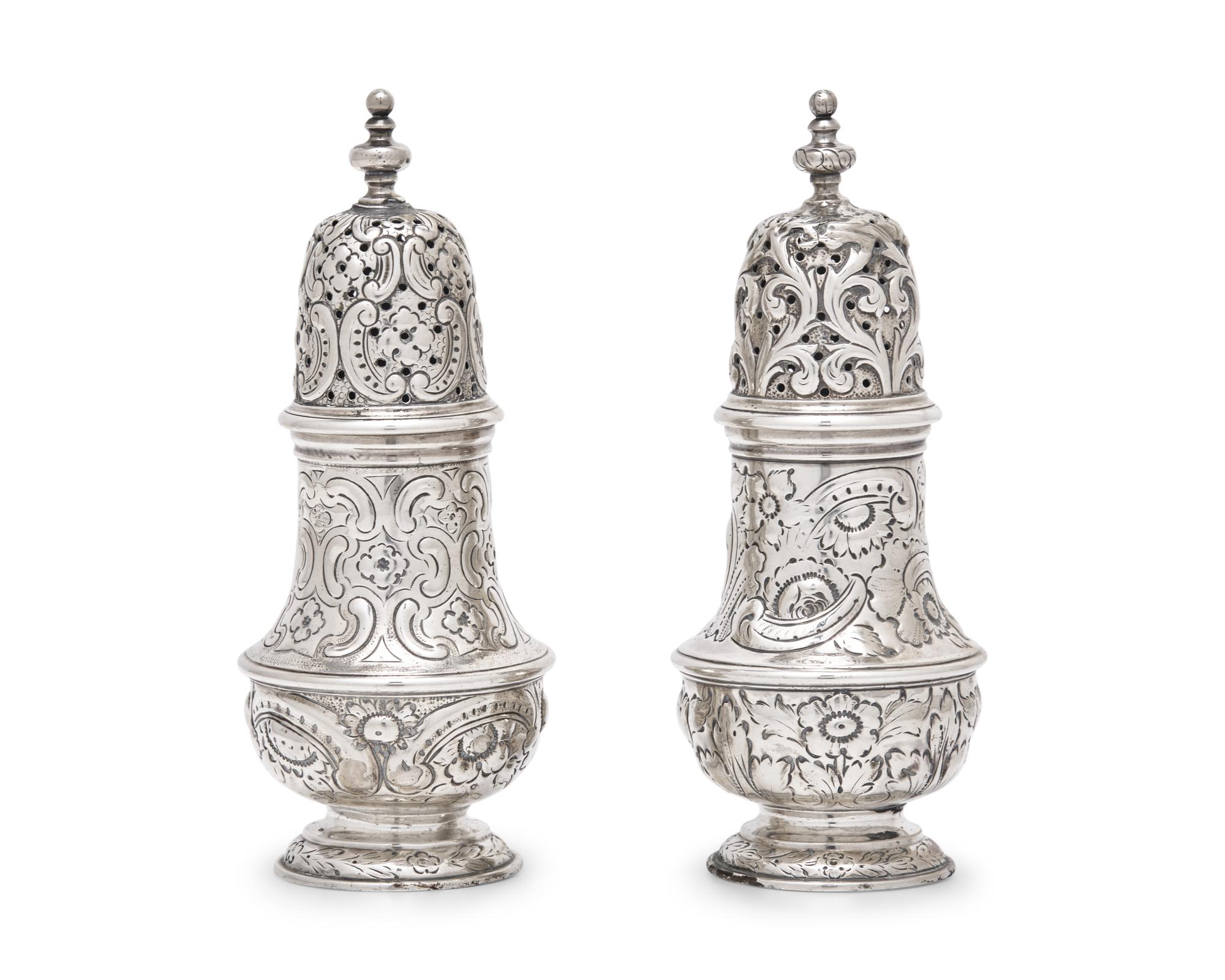 A Pair of Repousse Coin Silver Casters