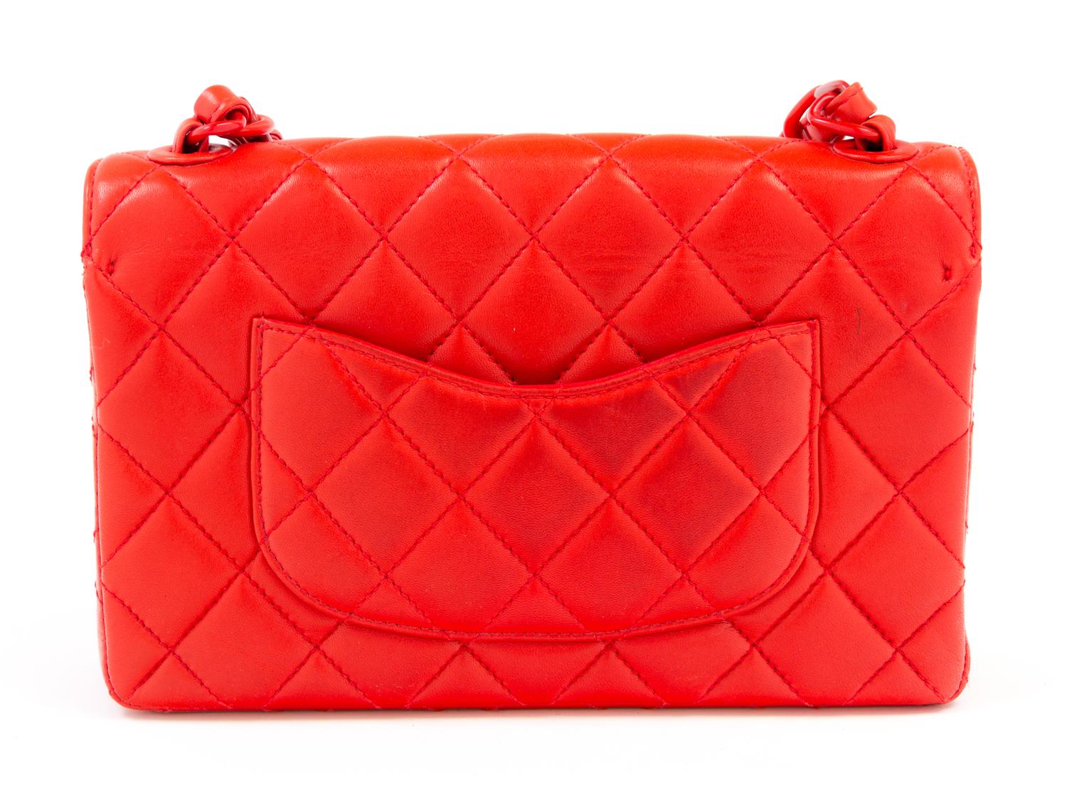 A Chanel Red Lambskin Quilted Flap Bag, 10" x 7" x 2.75"; Strap drop: 19".