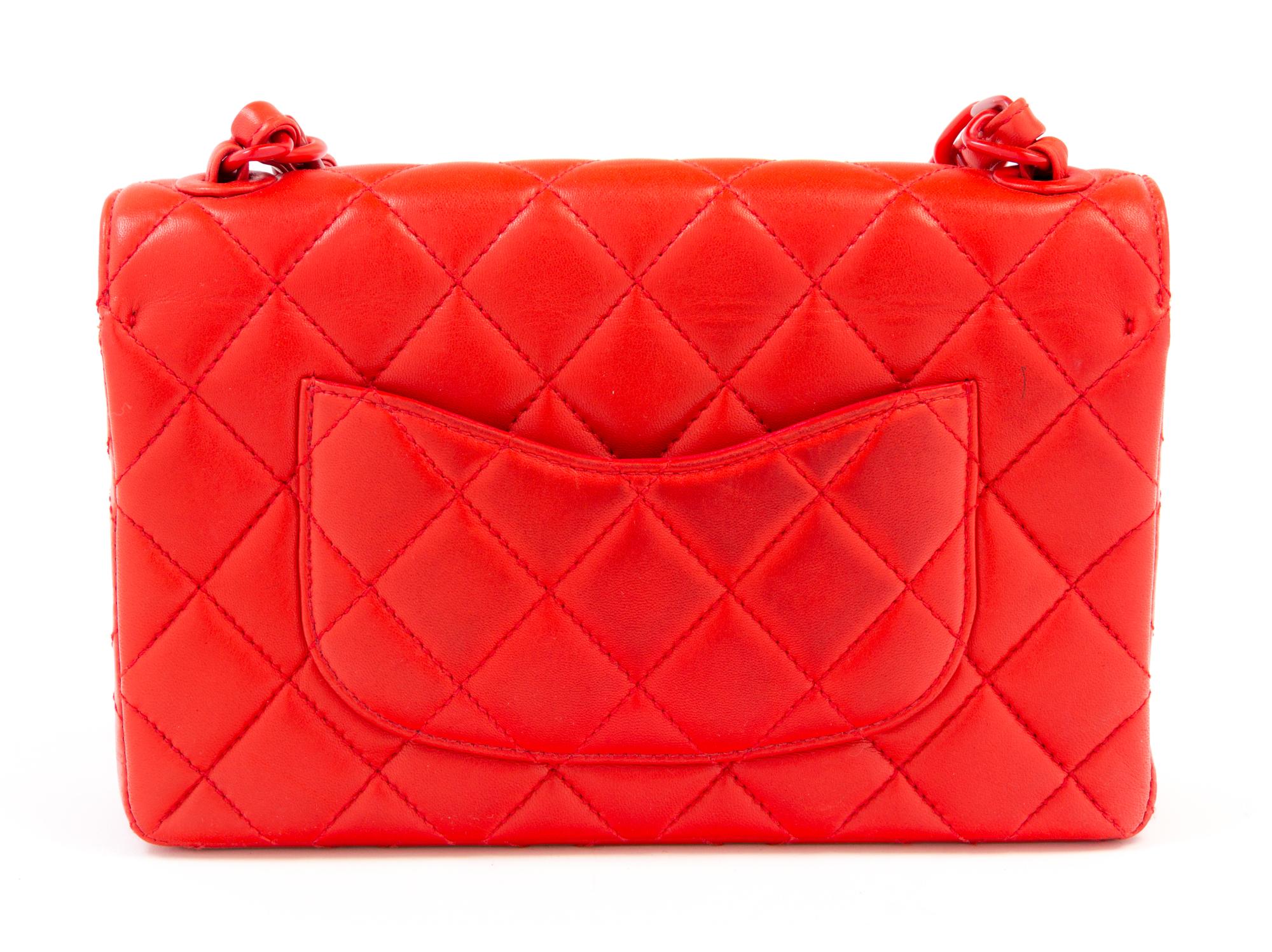 A Chanel Red Lambskin Quilted Flap Bag, 10" x 7" x 2.75"; Strap drop: 19".