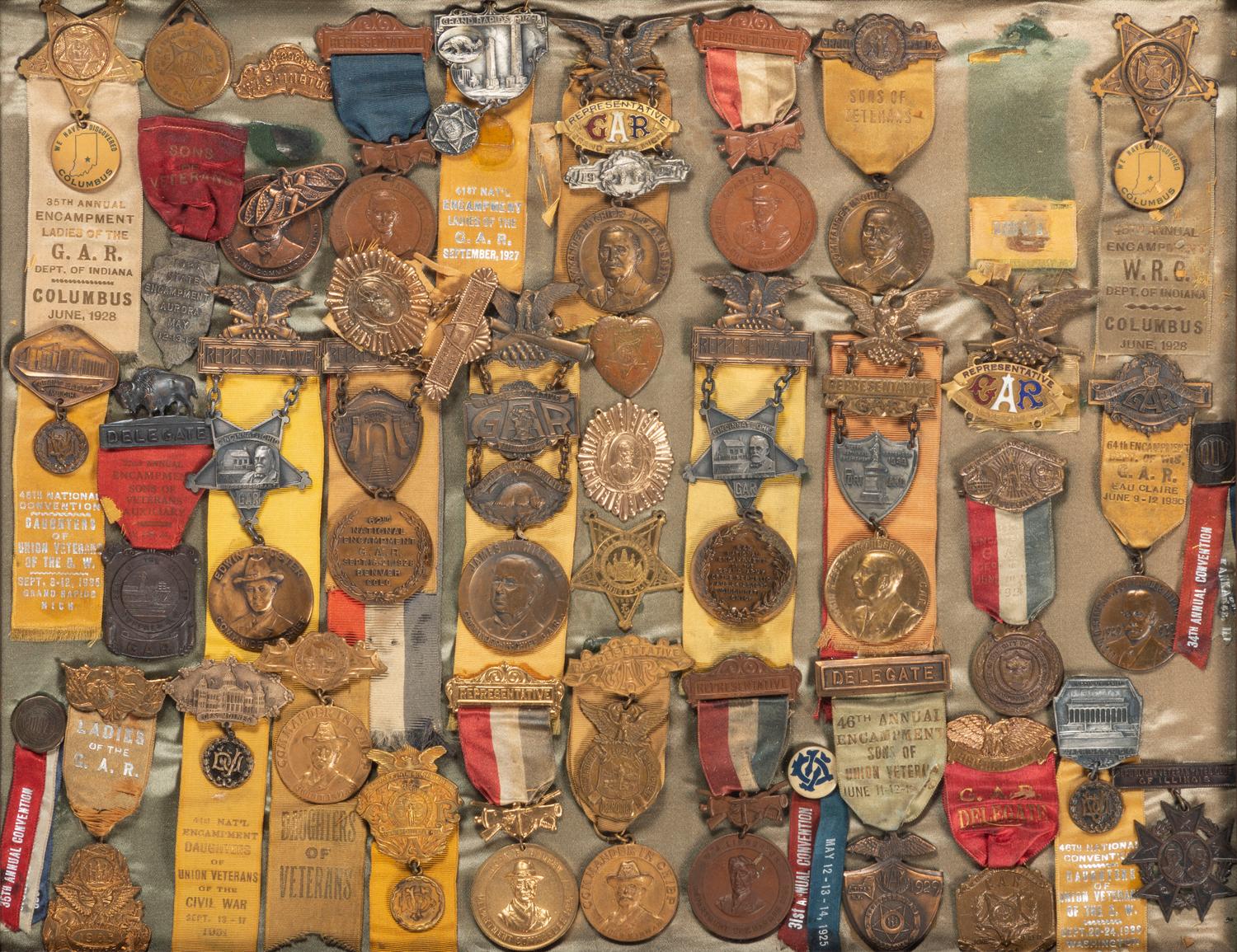 [CIVIL WAR - GRAND ARMY OF THE REPUBLIC]. A large framed collection of GAR and auxiliary organization medals and badges, including: