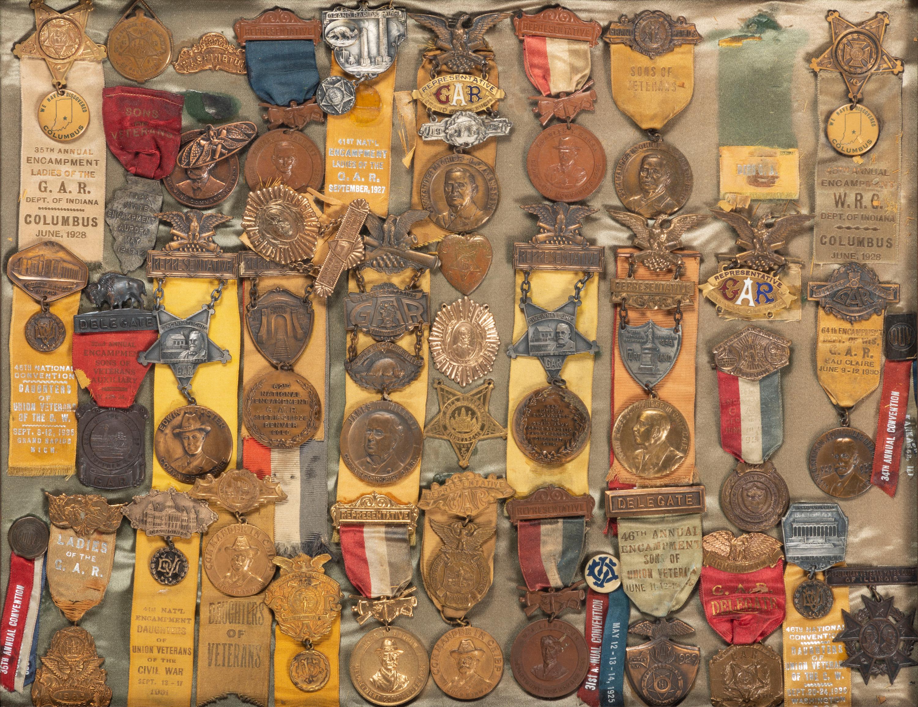 [CIVIL WAR - GRAND ARMY OF THE REPUBLIC]. A large framed collection of GAR and auxiliary organization medals and badges, including: