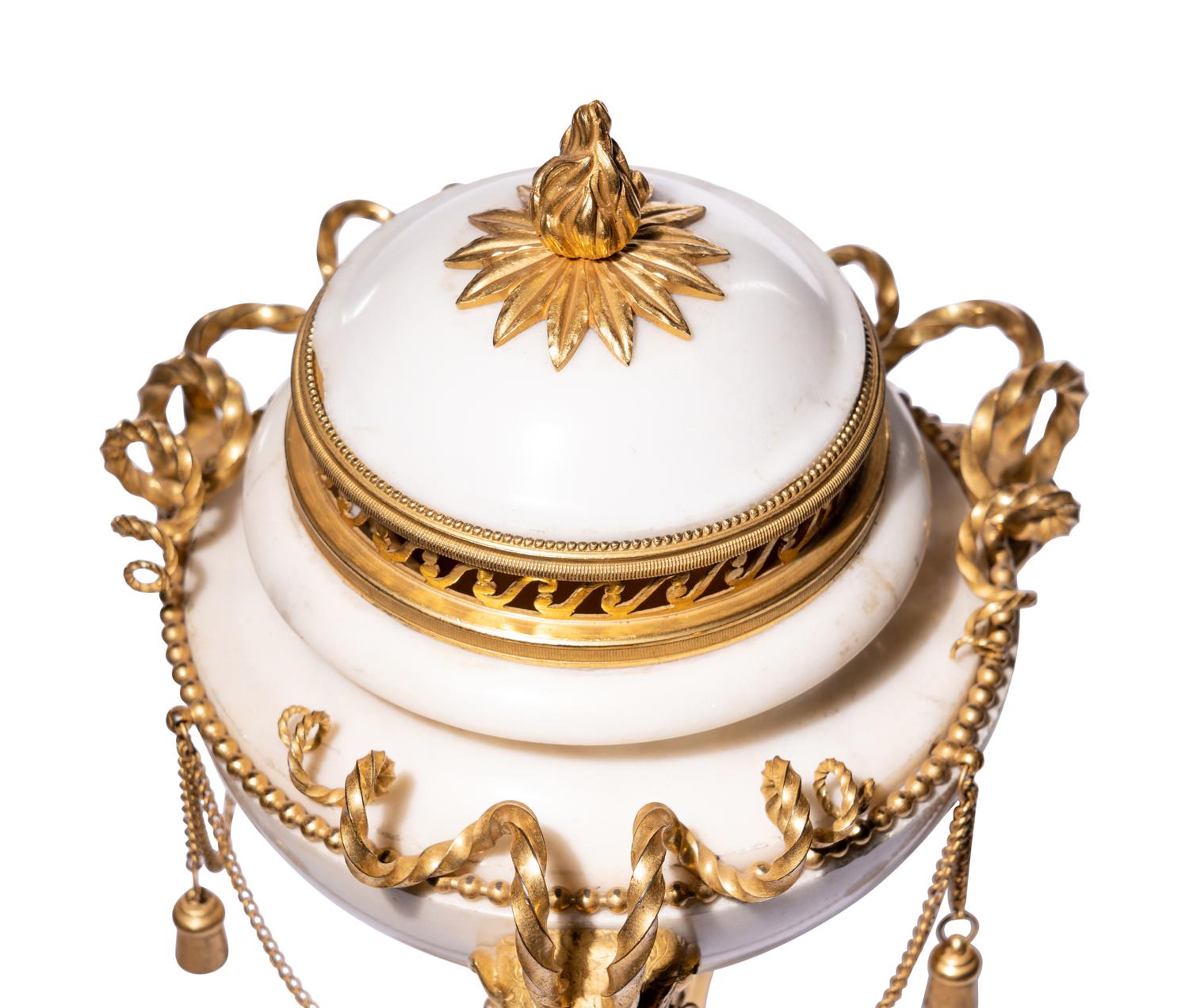 A Pair of Late Louis XVI Gilt Bronze Mounted White Marble Cassolettes