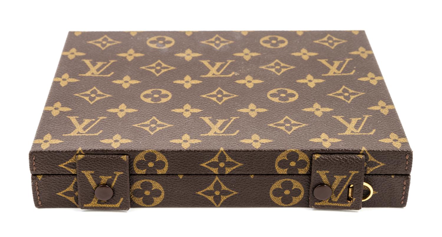 A Louis Vuitton Monogram Canvas Jewelry Box, 8.5" x 6.75" x 1.5".