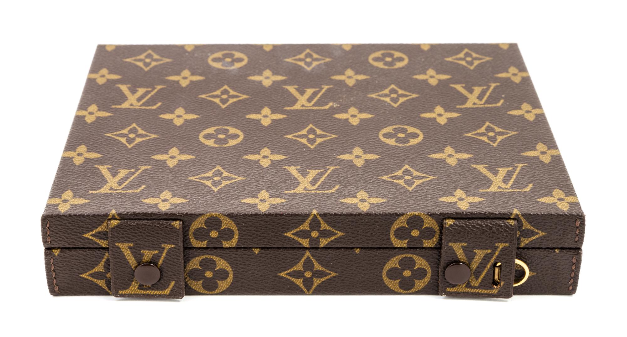 A Louis Vuitton Monogram Canvas Jewelry Box, 8.5" x 6.75" x 1.5".