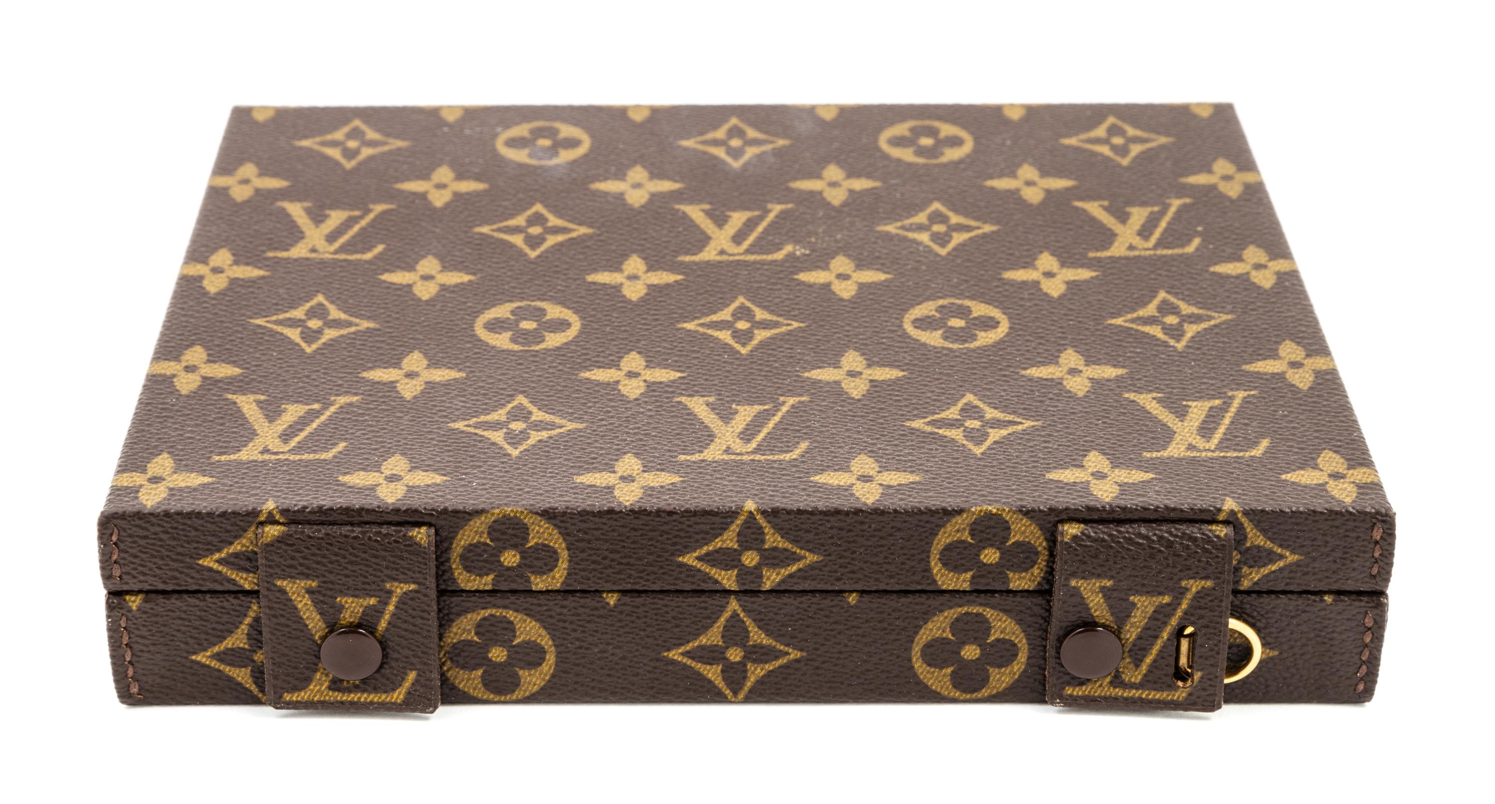 A Louis Vuitton Monogram Canvas Jewelry Box, 8.5" x 6.75" x 1.5".