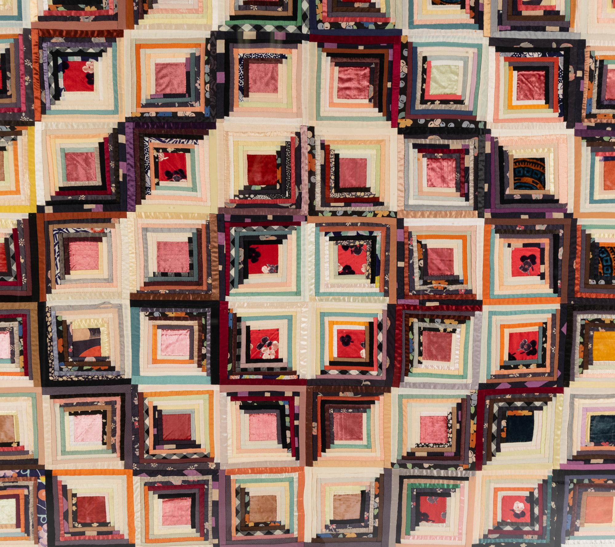 A Log Cabin Pattern Pieced Silk and Satin Quilt