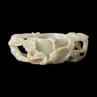 A Chinese Carved Pale Celadon Jade Floriform Coupe, Qing Dynasty or Earlier 清或更早 青白玉鏤雕梅花洗