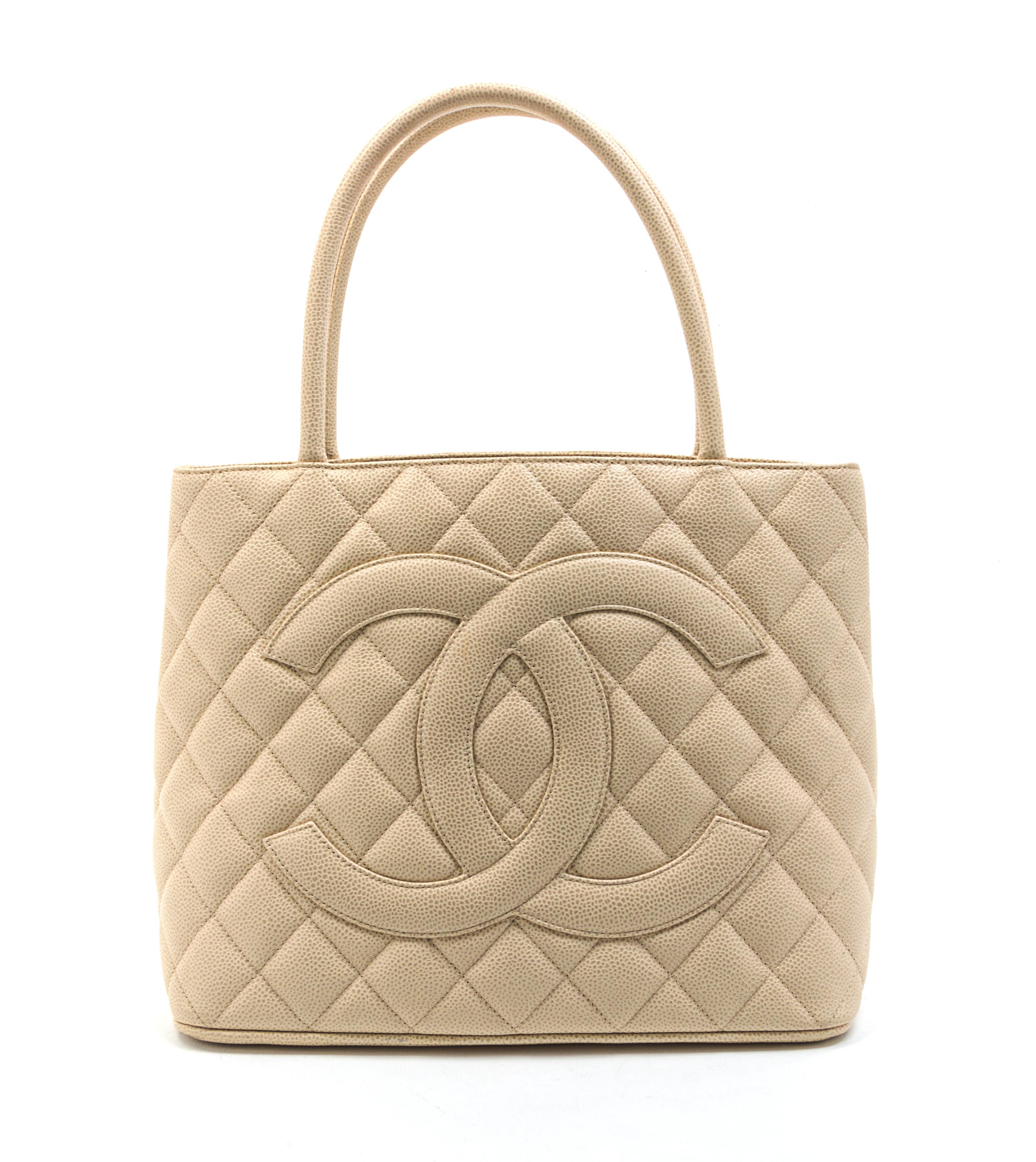 A Chanel Ivory Quilted Leather Medallion Tote Bag. 11 1/2 x 10 x 6 inches.