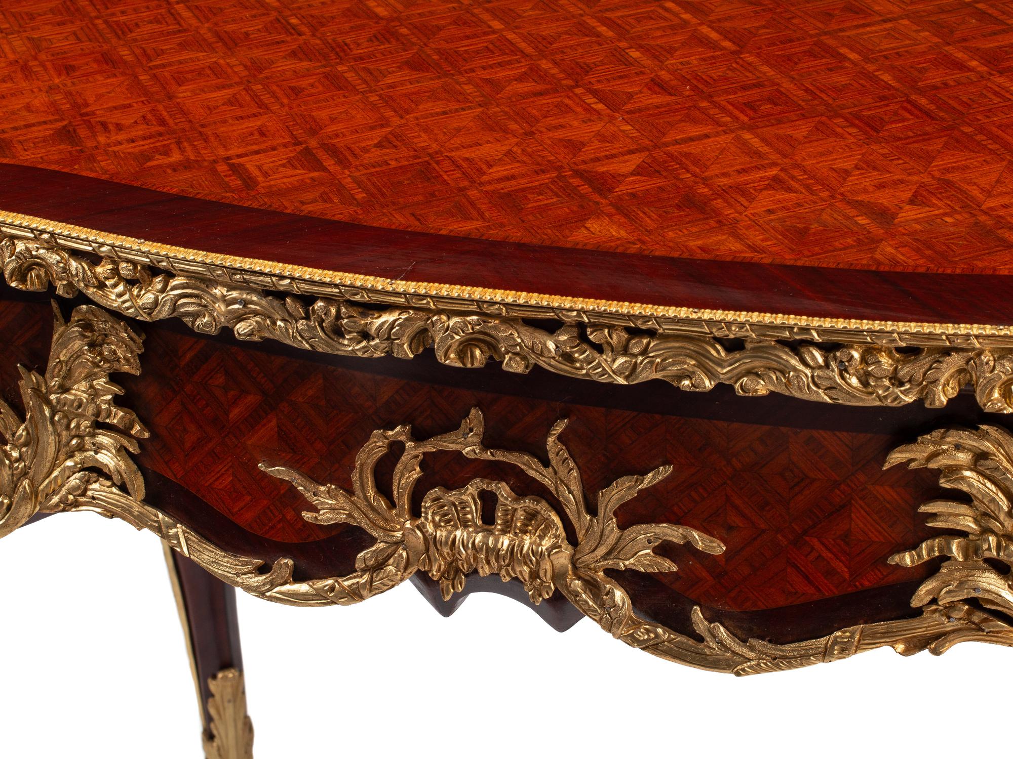 A Louis XV Style Gilt Bronze Mounted Parquetry Bureau Plat