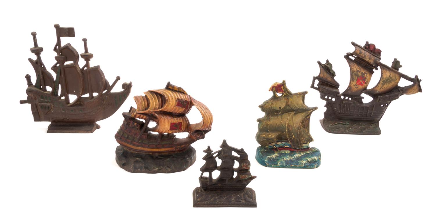 Five Victorian Cast Iron Doorstops Height of tallest 12 1/2 inches.