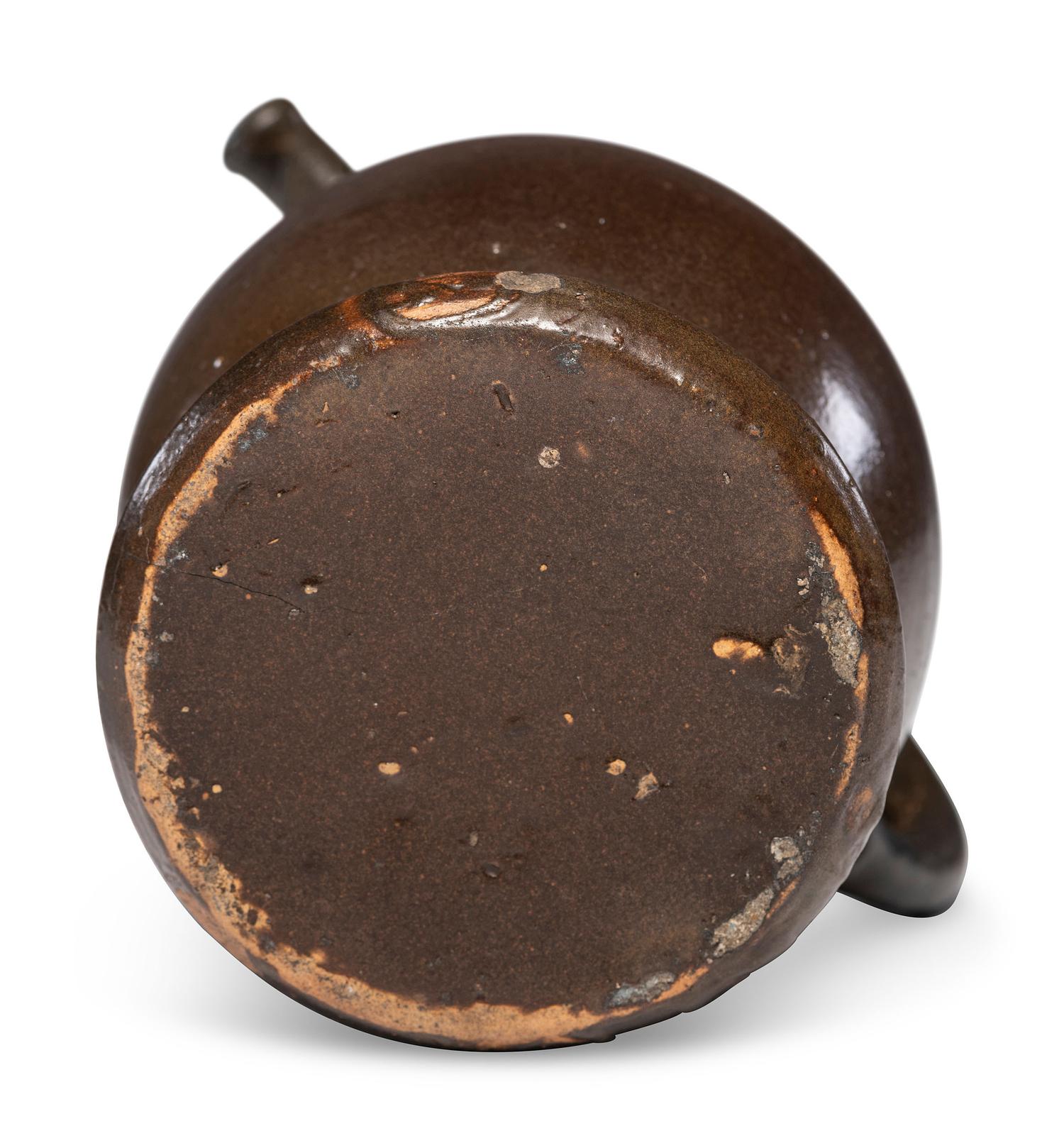 A Rare William Rowley Slip-Glazed Puzzle Jug