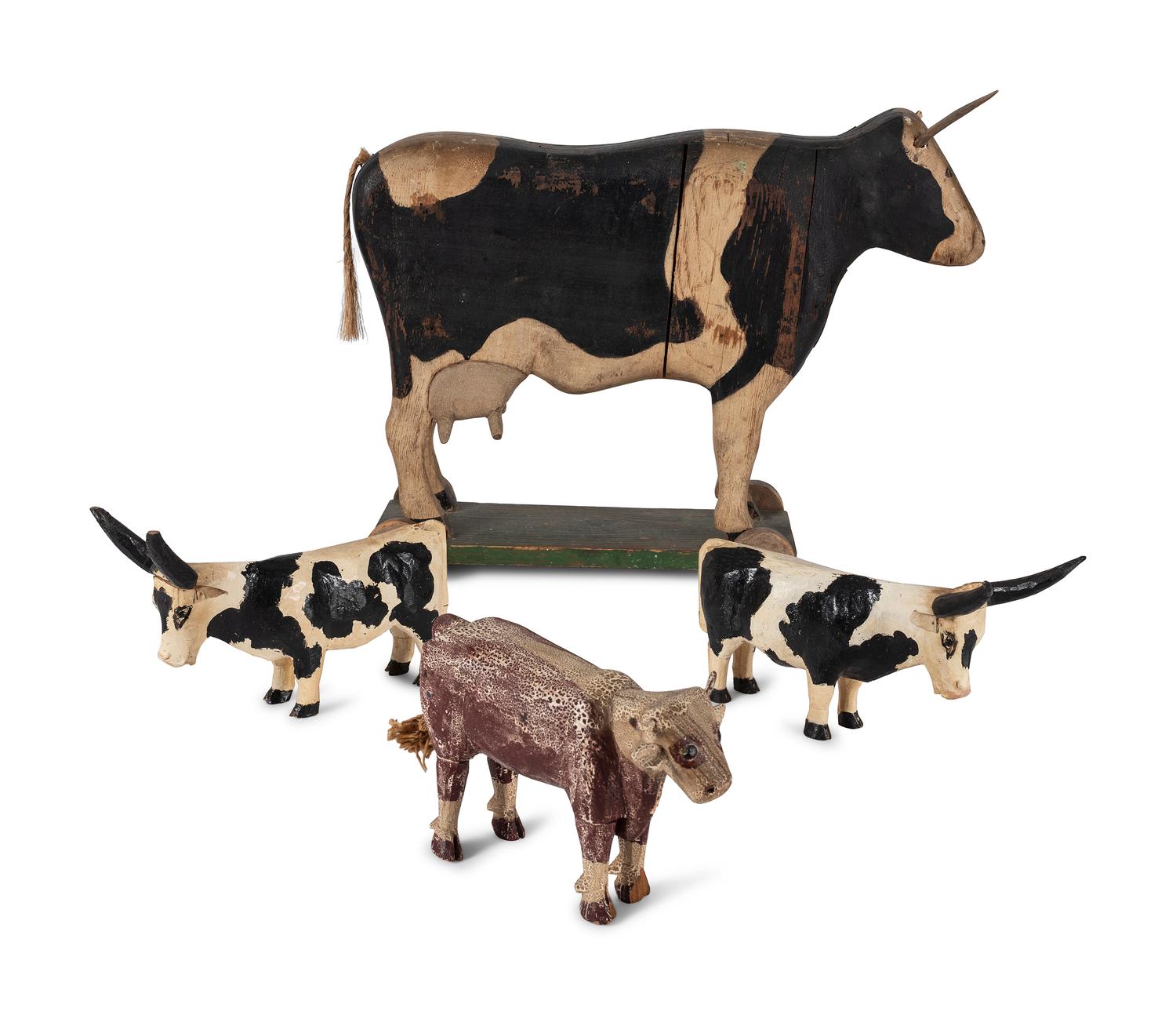 Four Carved Wood and Painted Folk Art Cows