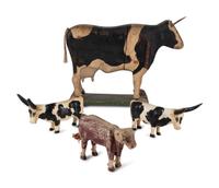 Four Carved Wood and Painted Folk Art Cows