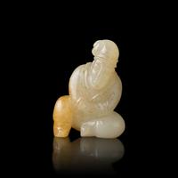 A Chinese Russet and White Jade Carved Foreigner 白玉帶沁胡人