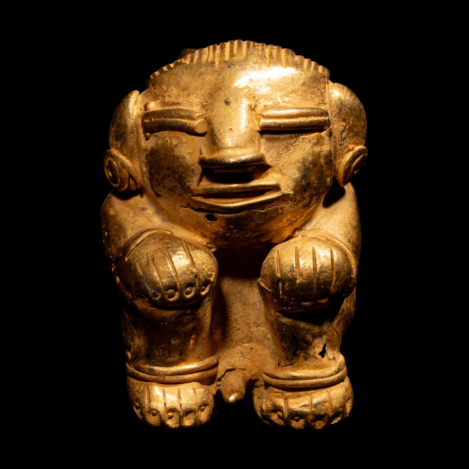 A Tairona Tumbaga Seated Female Figure