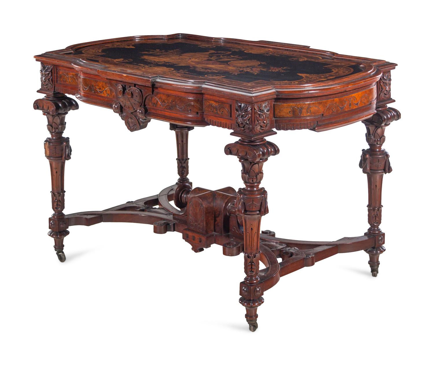 A Victorian Carved, Inlaid and Painted Walnut Writing Desk