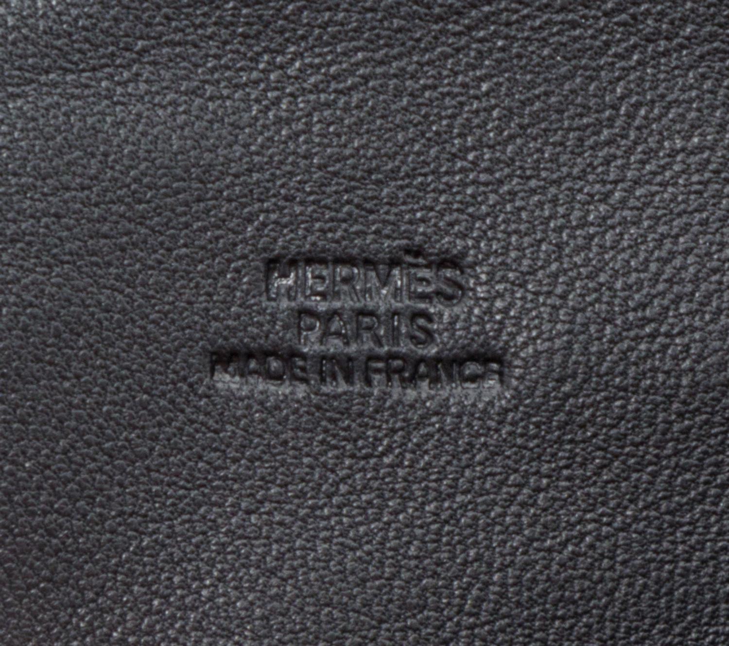 An Hermes Noir Agneau Crossbody Travel Pouch, 8" x 6" x .5".