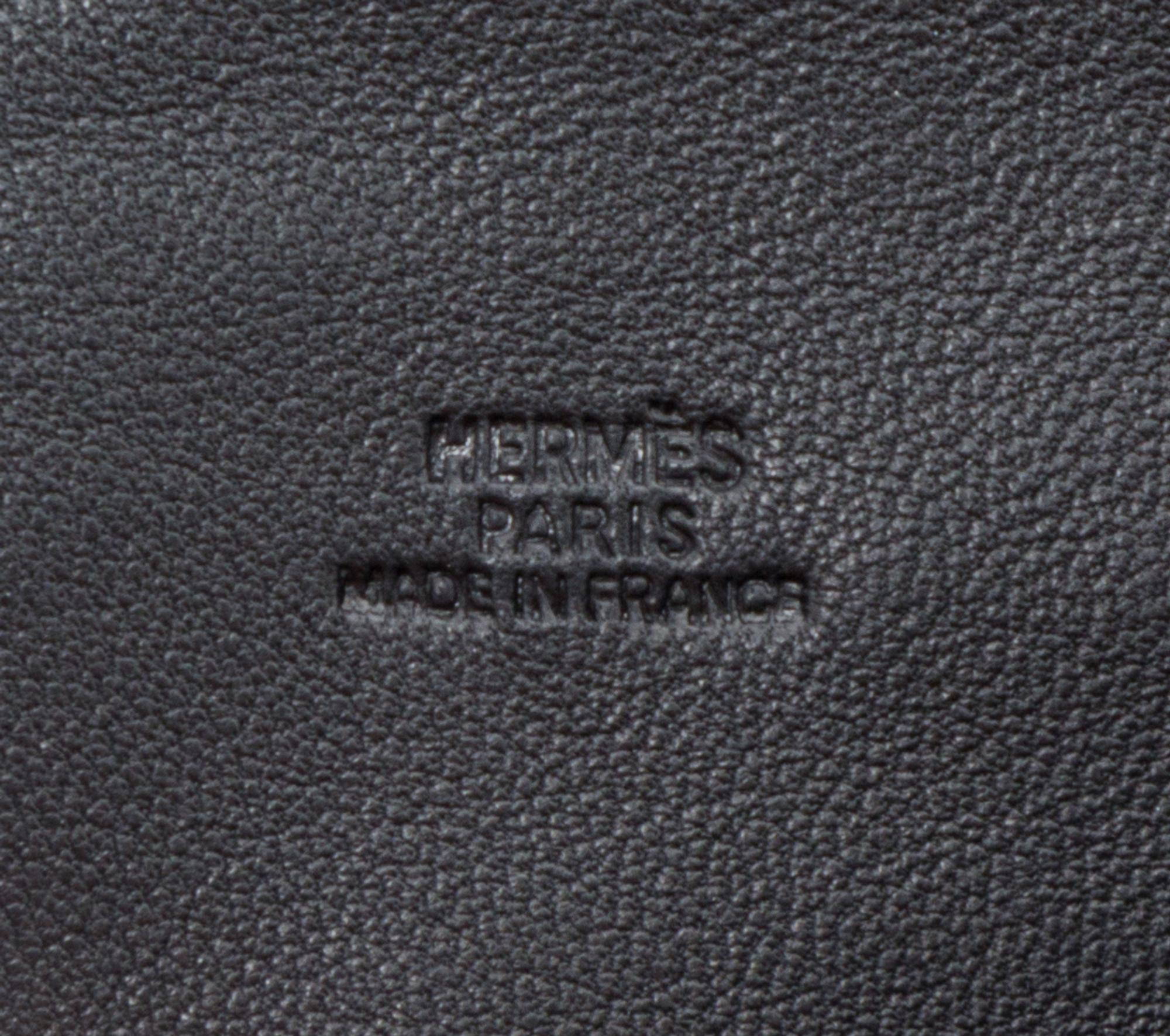 An Hermes Noir Agneau Crossbody Travel Pouch, 8" x 6" x .5".