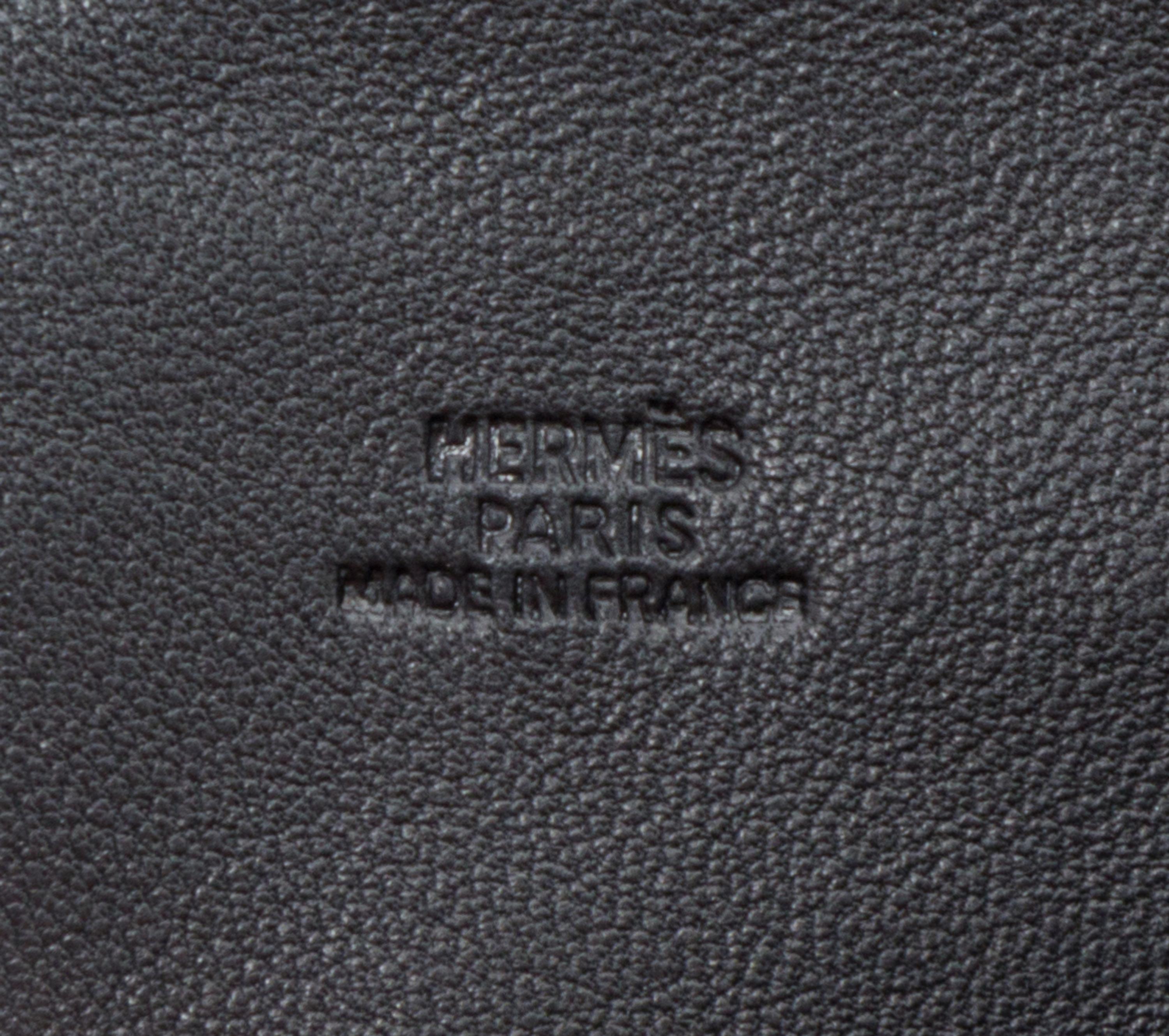An Hermes Noir Agneau Crossbody Travel Pouch, 8" x 6" x .5".