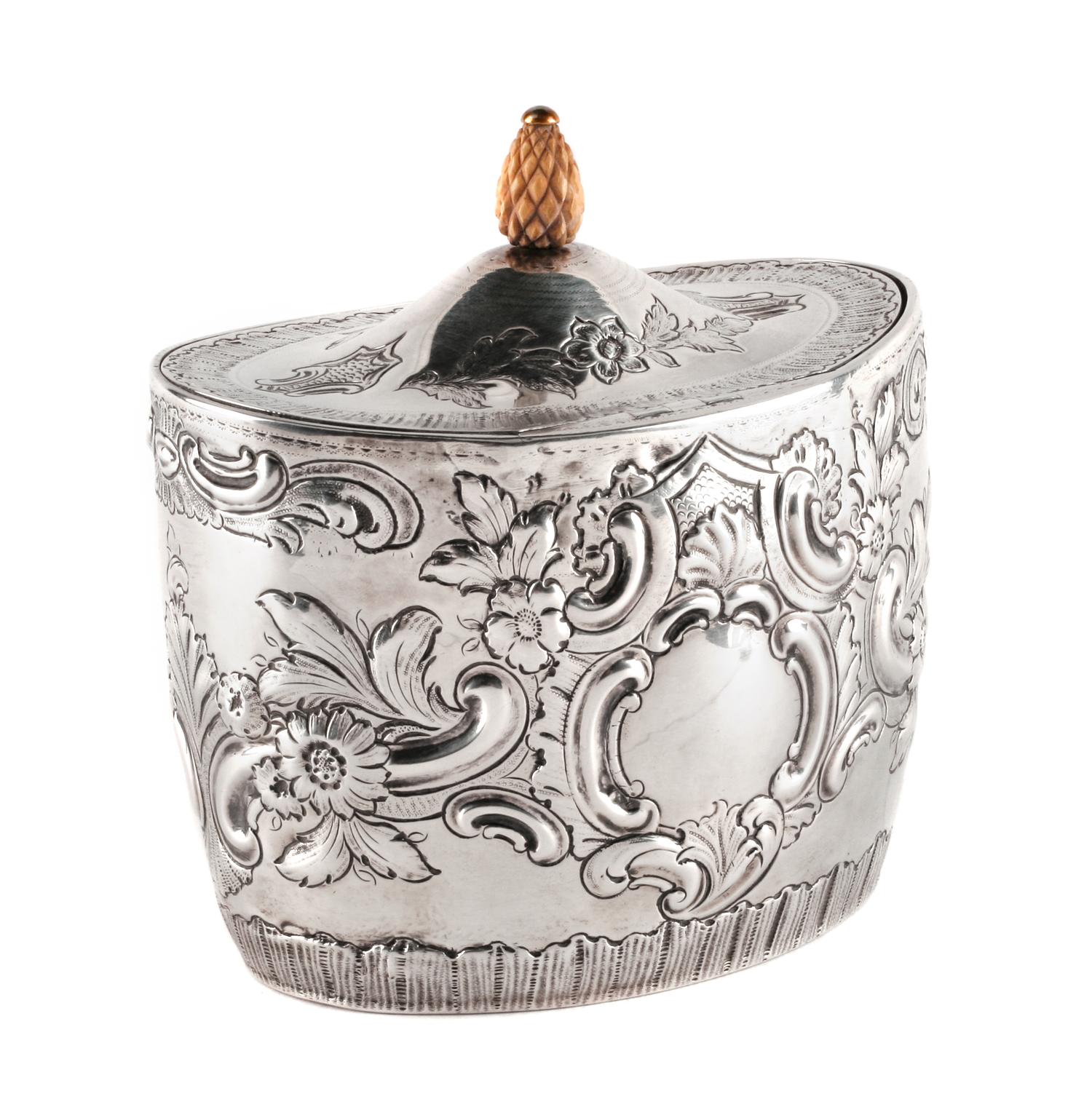 An English Silver Tea Caddy, John Schofield, London, 1794, the oval domed lid with a pinecone finial, the body bearing a vacant cartouc