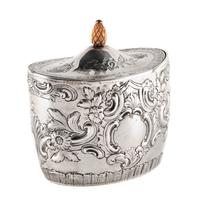 An English Silver Tea Caddy, John Schofield, London, 1794, the oval domed lid with a pinecone finial, the body bearing a vacant cartouc