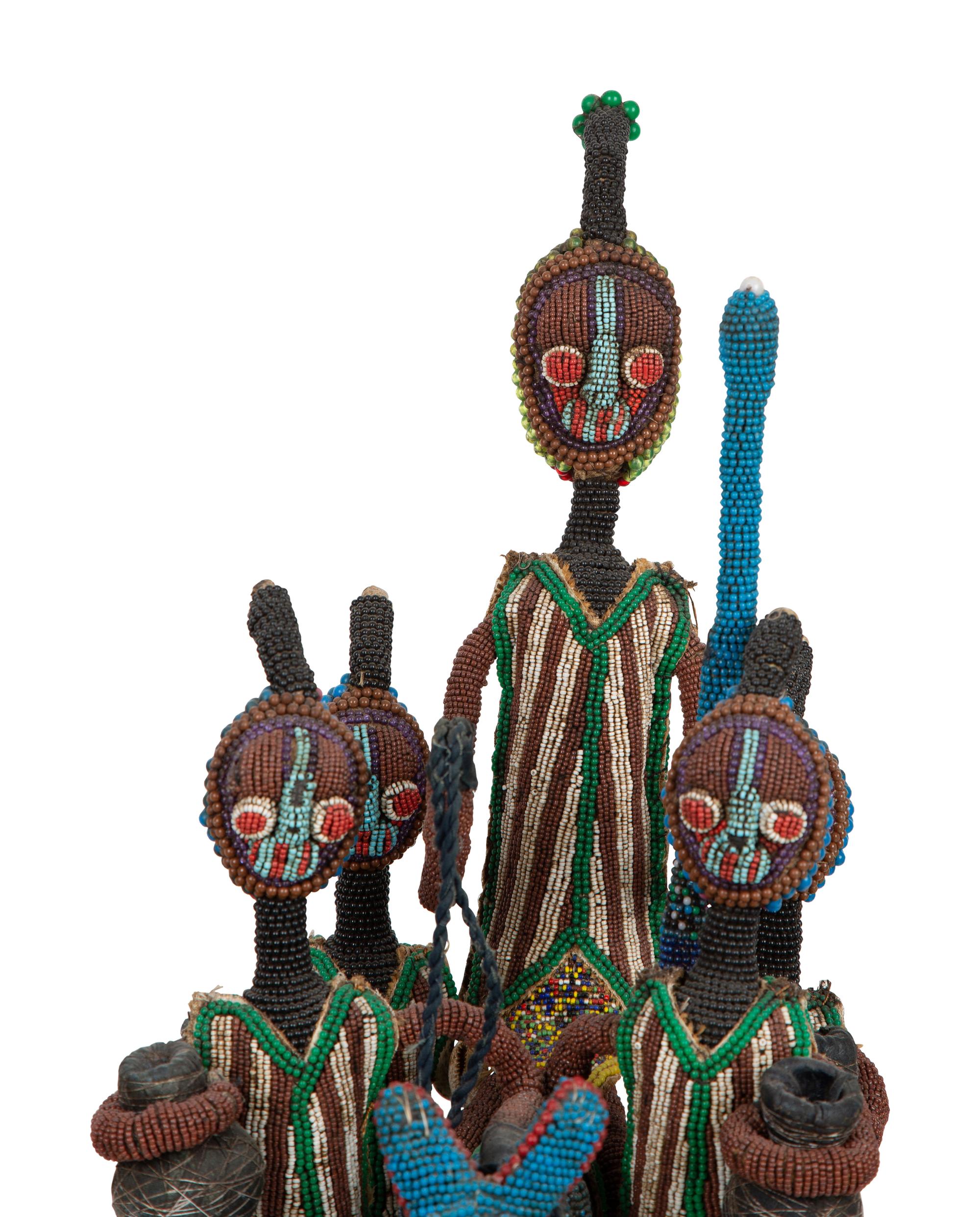 A Group of Three Yoruba Beaded Headdresses and Two Talisman Panels — 20TH CENTURY