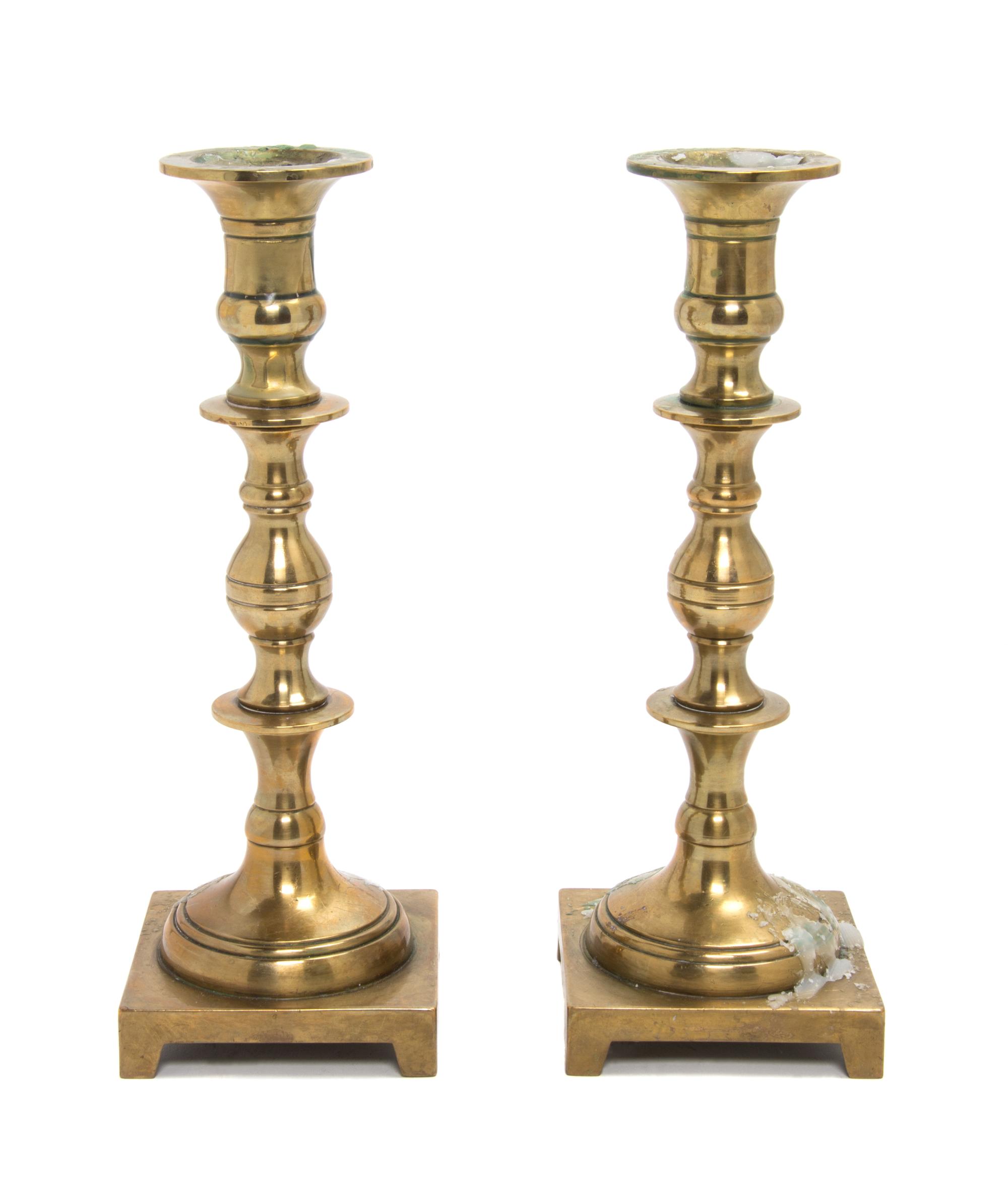A Pair of Brass Candlesticks Height 9 3/4 inches. — 20TH CENTURY