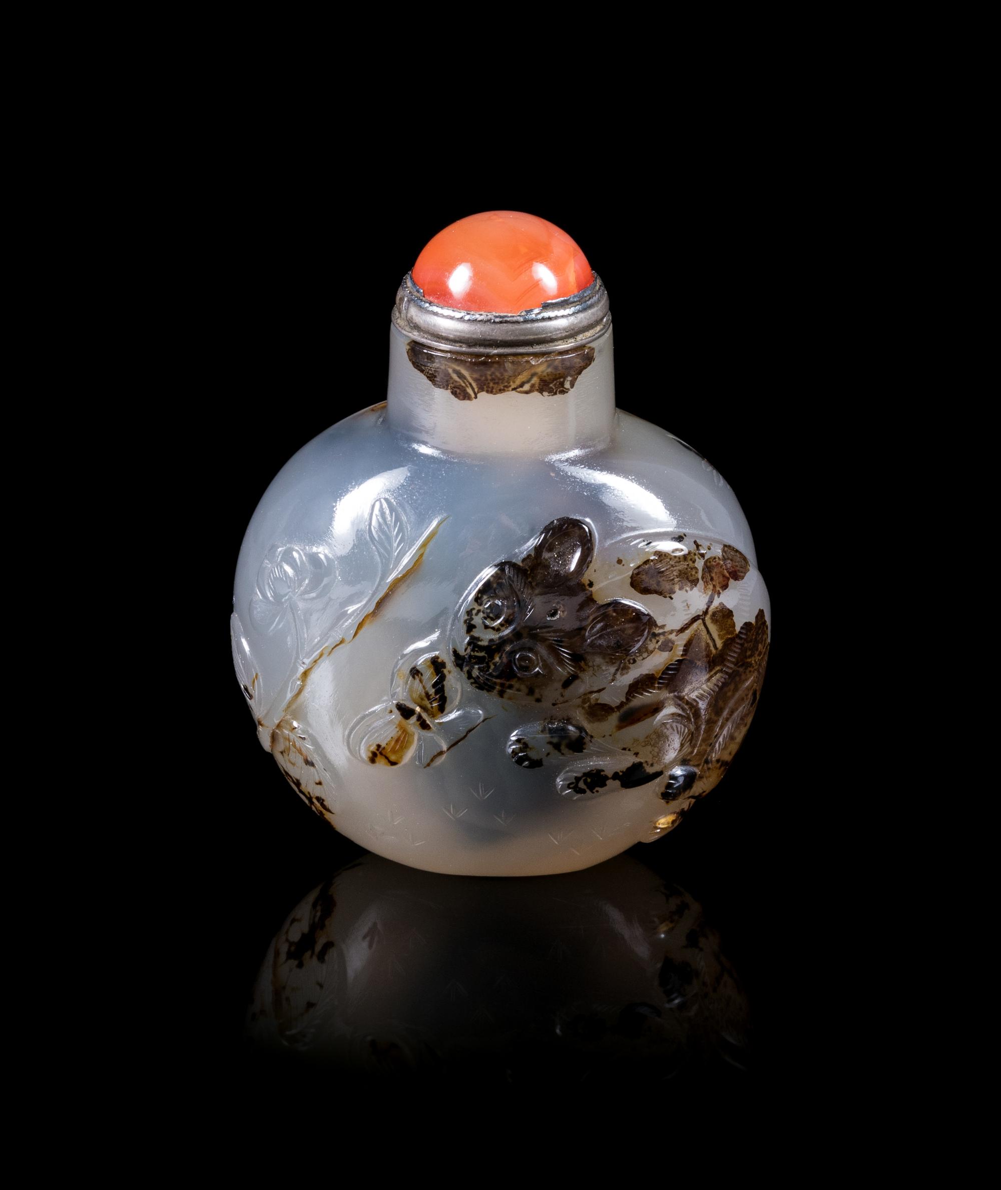 A Carved Black and Grey Agate Snuff Bottle Height overall 2 1/8 inches. — 19TH CENTURY