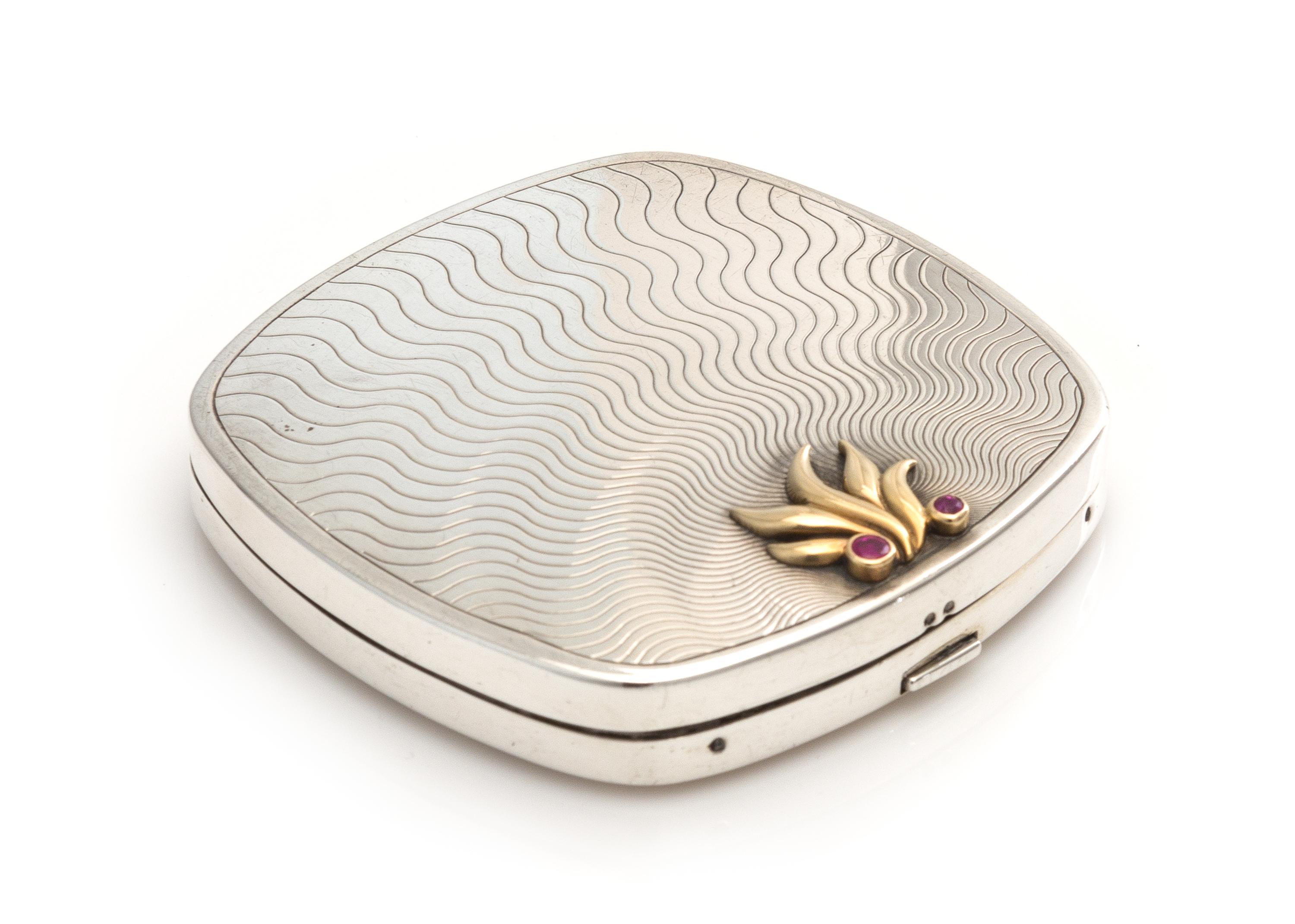 An American Silver, 14-Karat Gold and Ruby Inset Compact, Tiffany & Co., New York, NY, 20th Century, the engine turned lid with an appl